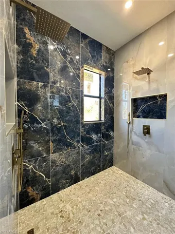 Full bath with tiled shower