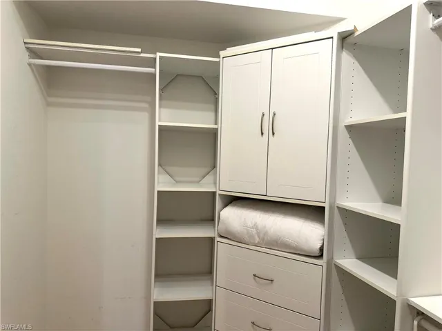 The main suite has a walk-in closet, plus a standard 6' closet.  This is the left side of the walk-in closet.