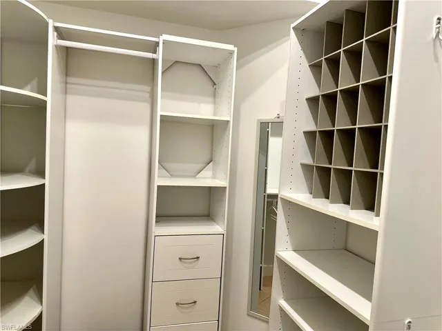 The right side of the walk-in closet.