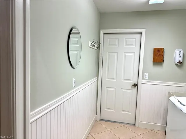The wainscoting in the laundry room gives it a fresh look.