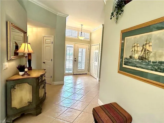 The front entry is open and airy.  The entry door and the windows throughout the house have plantation shutters.  A nice feature for southern homes, and added value.