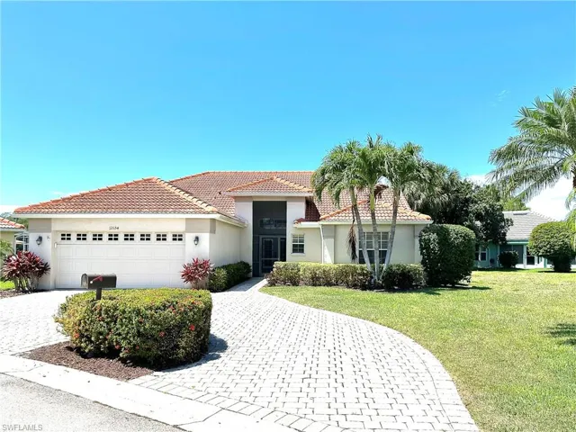 Circular, paver driveway adds curb appeal and convenience for the owner.