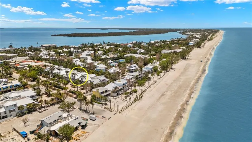Aerial view of residential area with expansive beach