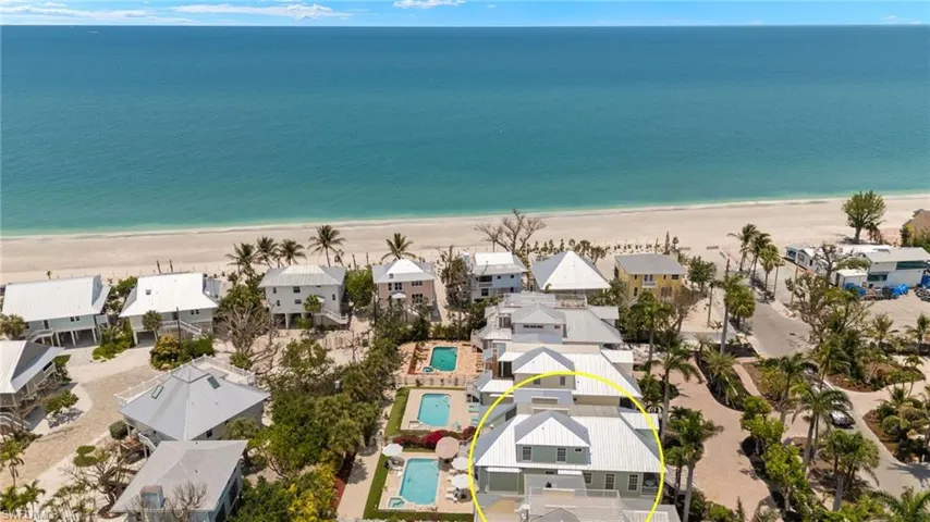 Aerial perspective of suburban area featuring unending shoreline
