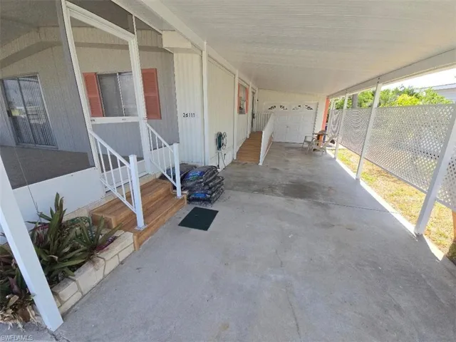 View of patio / terrace with a carport