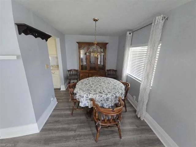 Dining room featuring baseboards and wood finished floors