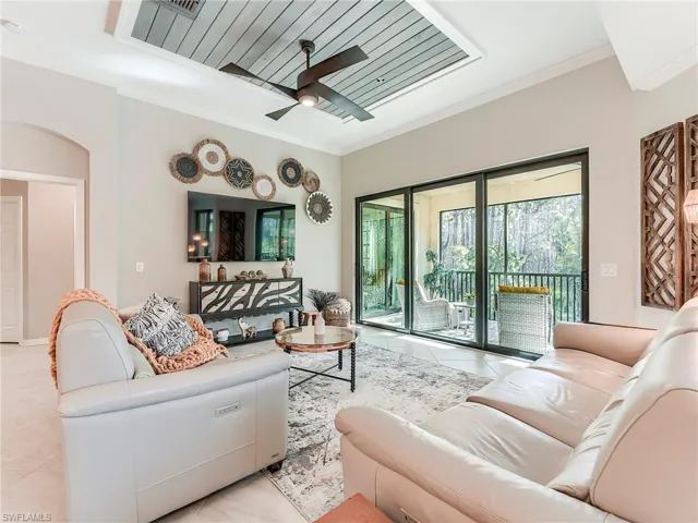The great room features 11' high ceilings and custom millwork
