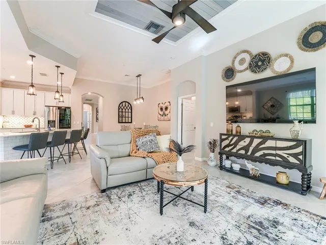 The great room features 11' high ceilings and custom millwork