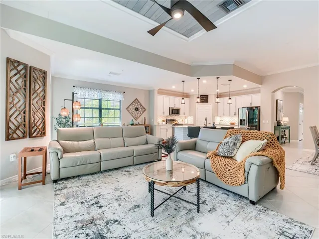 The great room features 11' high ceilings and custom millwork and high end ceiling fan