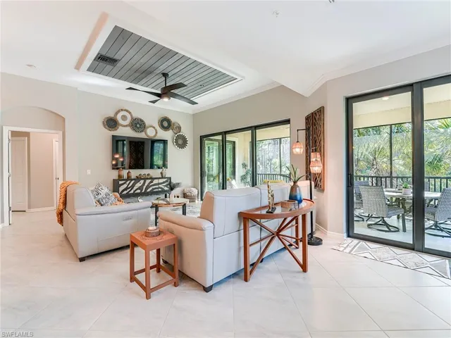 The great room features 11' high ceilings and custom millwork