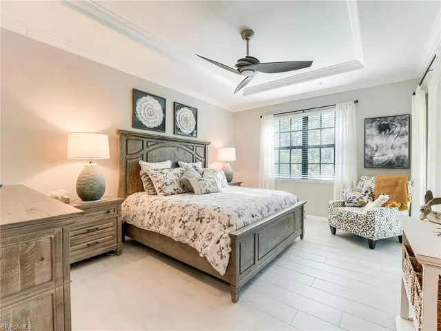 The spacious master has custom millwork and raised tray ceilings