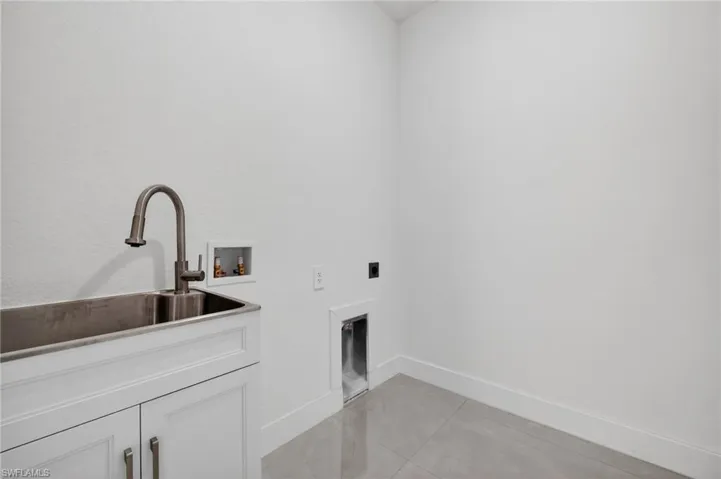 Laundry room with utility sink included — practical upgrades already completed.