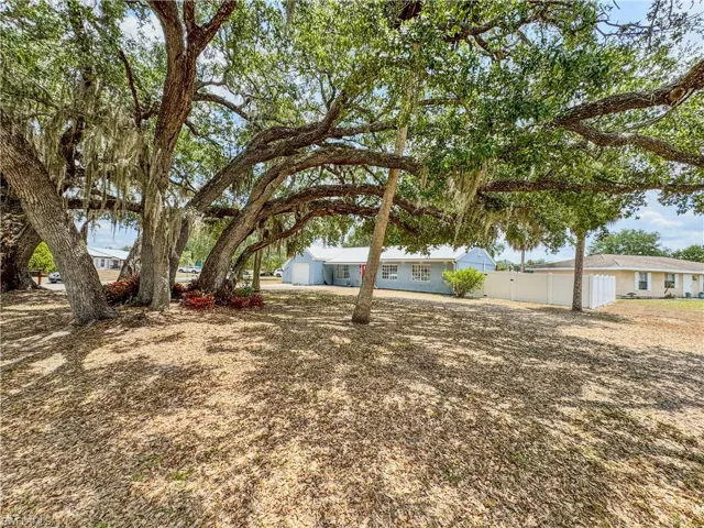 View of yard featuring fence