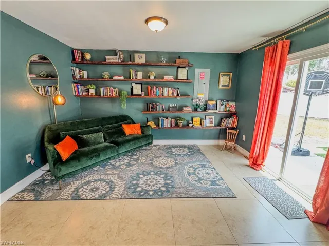 Sitting room with tile patterned flooring and baseboards