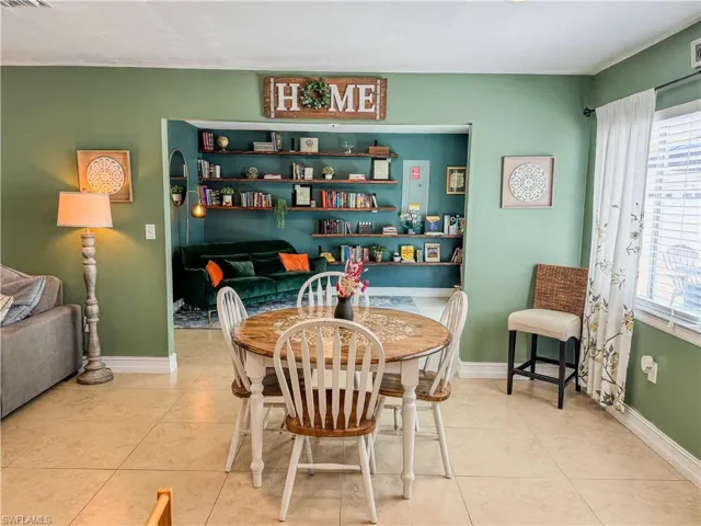 Dining space featuring tile patterned flooring and baseboards