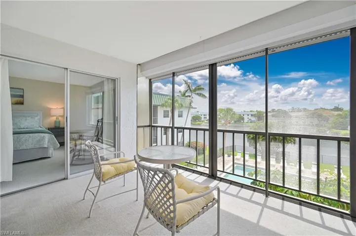 Screened balcony offering expansive water and sky vistas