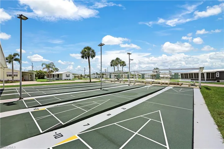 View of home's community with shuffleboard