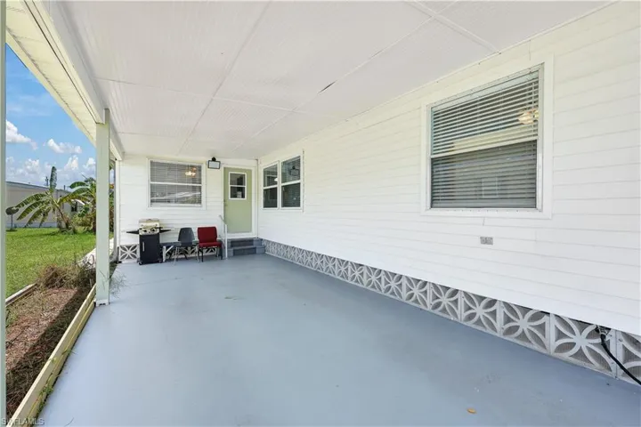 View of patio / terrace with a carport and grilling area