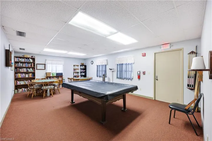 Recreation room featuring pool table and a paneled ceiling