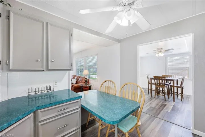 Dining space with dark wood-style flooring