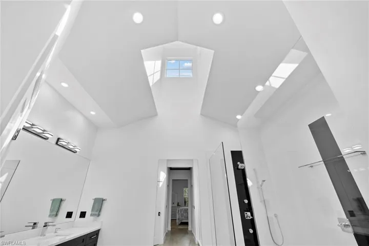 Vaulted Ceiling in Master Bathroom with plenty of Natural Light.