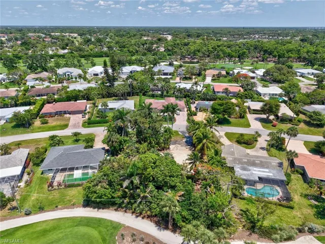 Aerial view of residential area with a pool