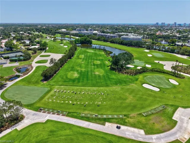 Bird's eye view of a nearby body of water and a golf club