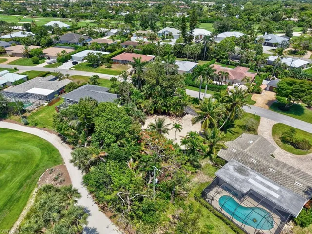Aerial perspective of suburban area featuring a pool area