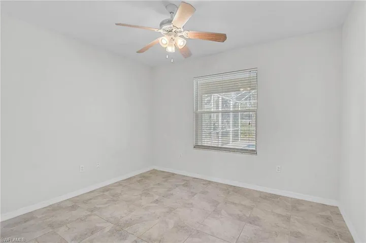 Bedroom 2 with baseboards and a ceiling fan
