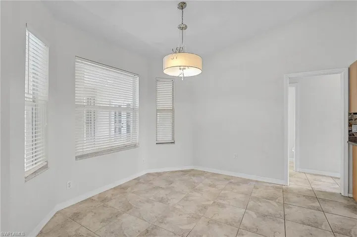 Empty room featuring baseboards