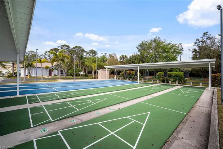 View of property's community with shuffleboard