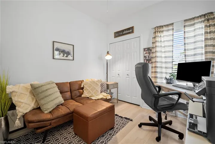 Office space featuring light wood-type flooring