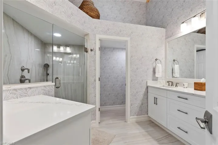 Bathroom with vanity and walk in shower