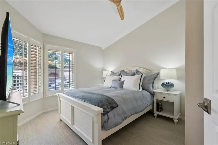 Bedroom featuring ceiling fan and light colored carpet