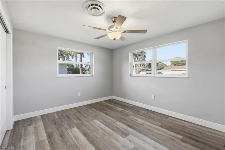 Unfurnished #2 room with light wood-style floors and ceiling fan