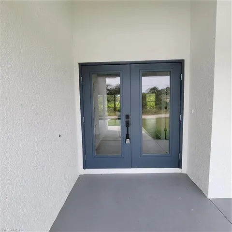 Entrance to property with french doors