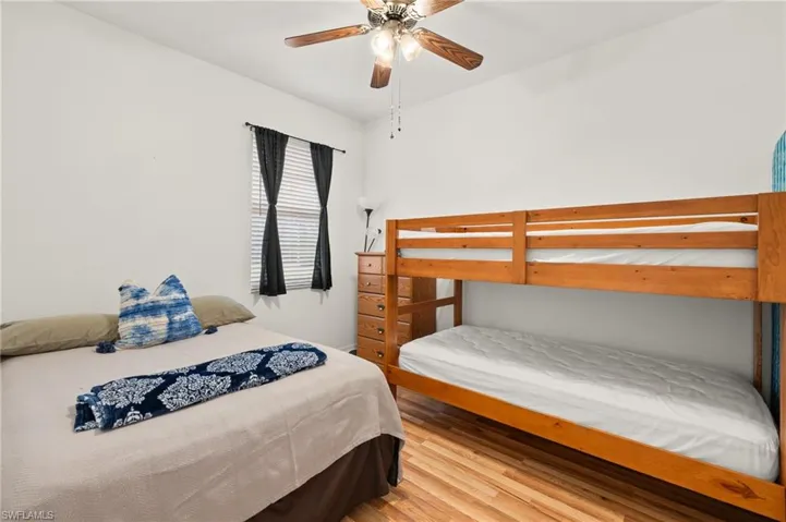 Bedroom with wood-type flooring and ceiling fan