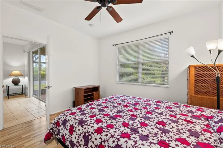 Bedroom with ceiling fan and light wood-type flooring