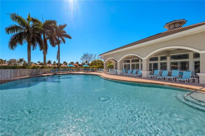 View of swimming pool featuring ceiling fan and a patio