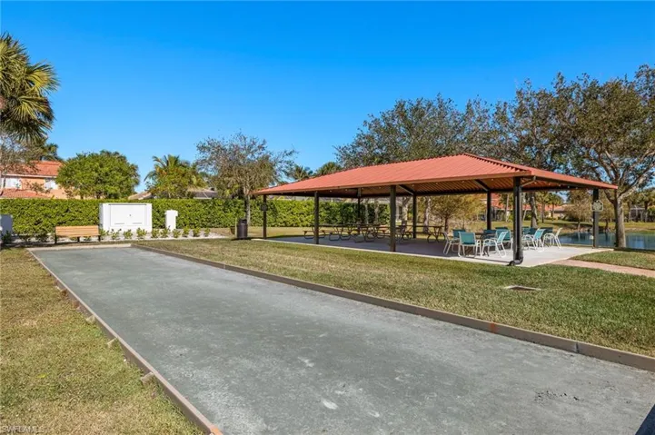 View of property's community featuring a gazebo, a water view, and a yard