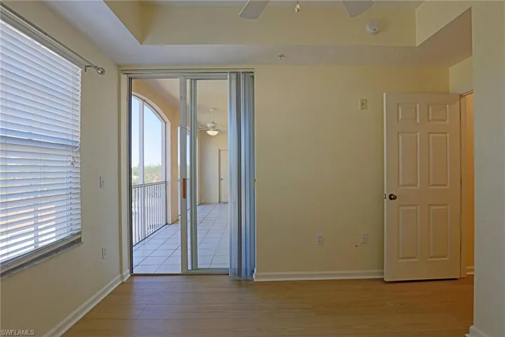 Spare room with a ceiling fan and light wood-style floors