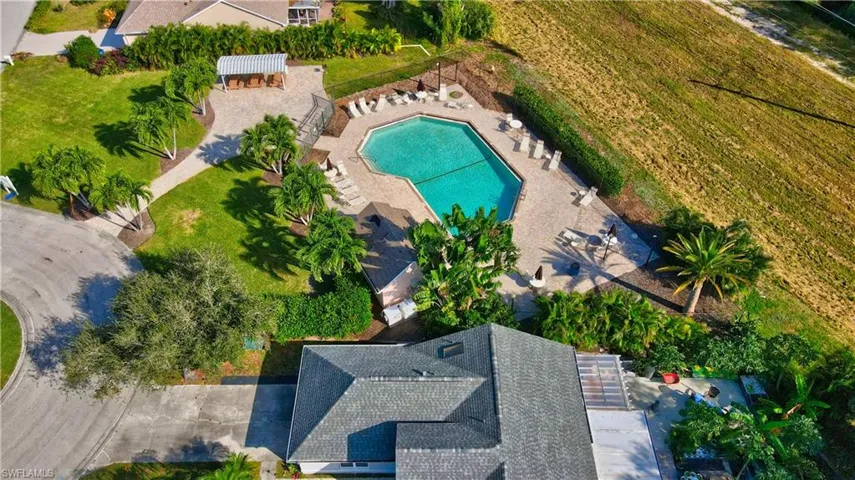 View of Meadow Community Pool. Smaller pool a short walk from the house. Picnic tables available in front of the pool area.