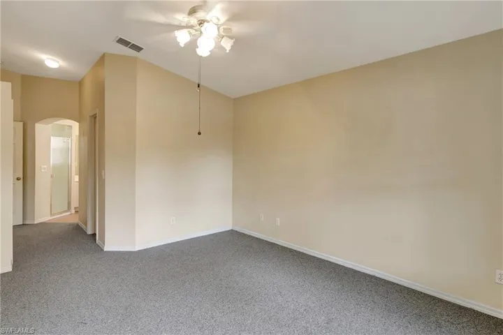 View of Master Bedroom from the back window. Master bedroom has his and hers closets.