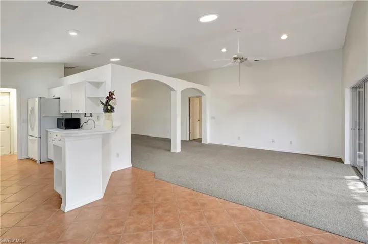 View of kitchenet area and living room. Lots of natural light through our the house thanks to the Solatube/skylights.