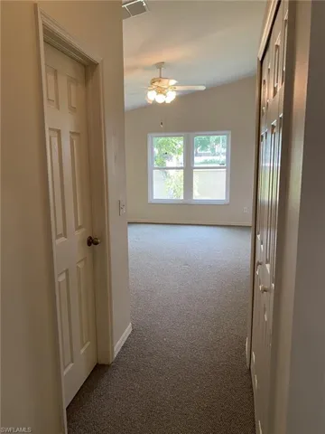 Master Bedroom Corridor featuring his and hers closets