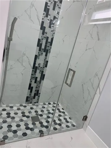 Bathroom featuring a shower with shower door