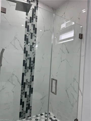 Bathroom featuring a shower with shower door