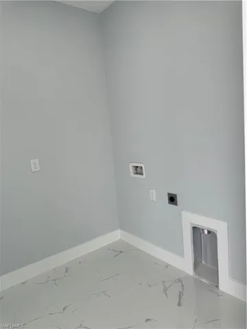 Laundry room featuring washer hookup and electric dryer hookup
