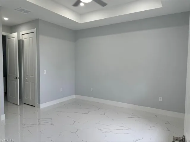 Empty room featuring ceiling fan