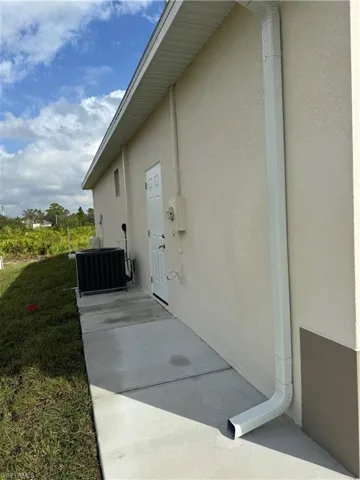 View of property exterior with central air condition unit